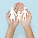 Happy family paper hand craft charity symbol